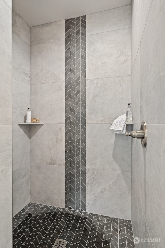 bathroom with tiled shower