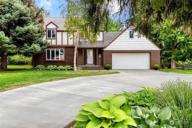 view of front of property with a garage and a front lawn