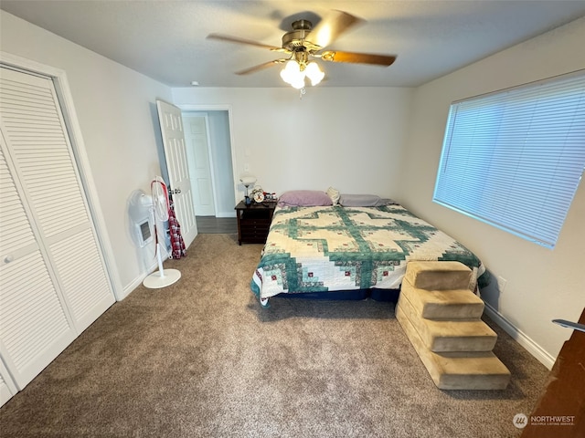 carpeted bedroom featuring a closet and ceiling fan