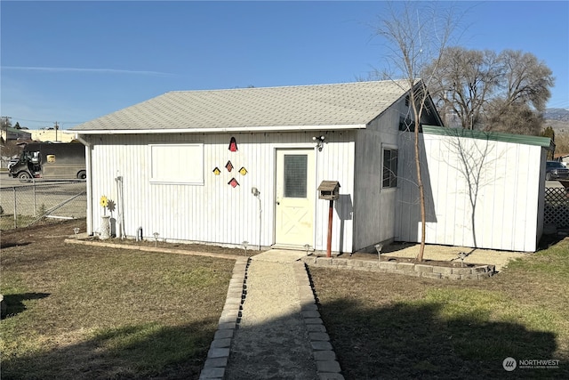 view of outbuilding with a yard