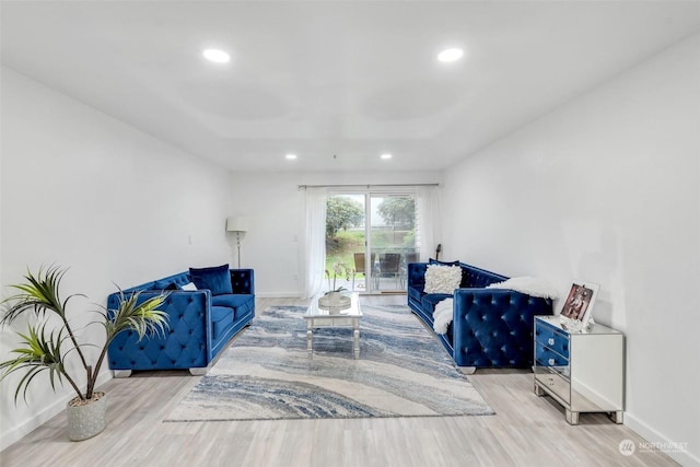 living room with recessed lighting, wood finished floors, and baseboards