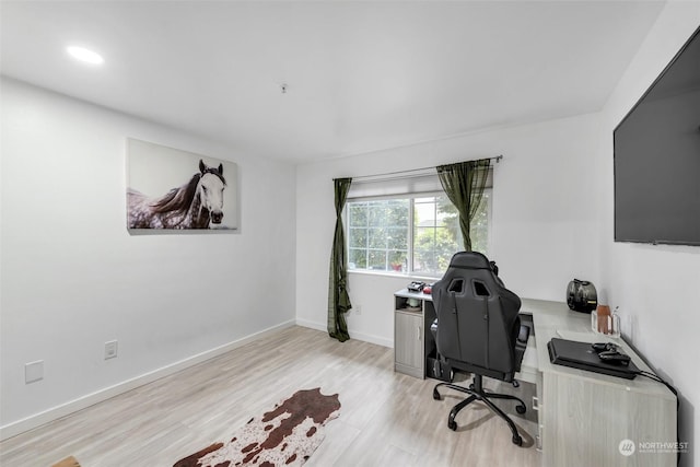 office with light wood-type flooring, baseboards, and recessed lighting