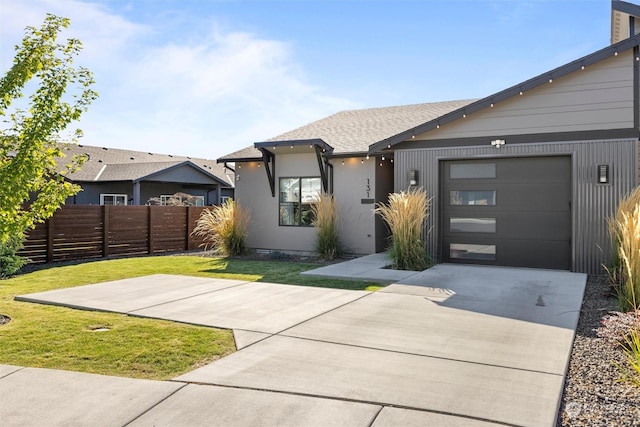 131 Sonoma Pl, Walla Walla, WA 99362 - view of front of home with driveway, fence, a front lawn, a shingled roof, and a garage