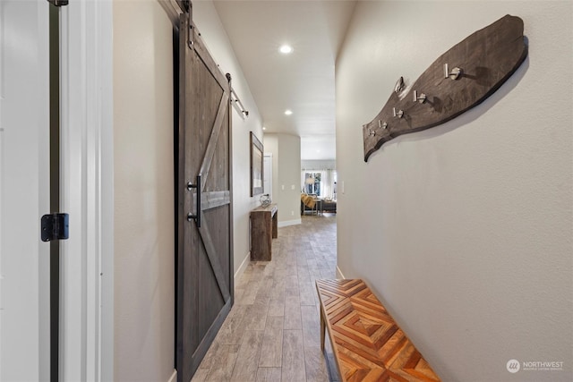 131 Sonoma Pl, Walla Walla, WA 99362 - hallway featuring baseboards, a barn door, light wood-style flooring, and recessed lighting