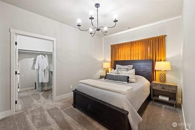 131 Sonoma Pl, Walla Walla, WA 99362 - bedroom with carpet flooring, a walk in closet, baseboards, visible vents, and an inviting chandelier