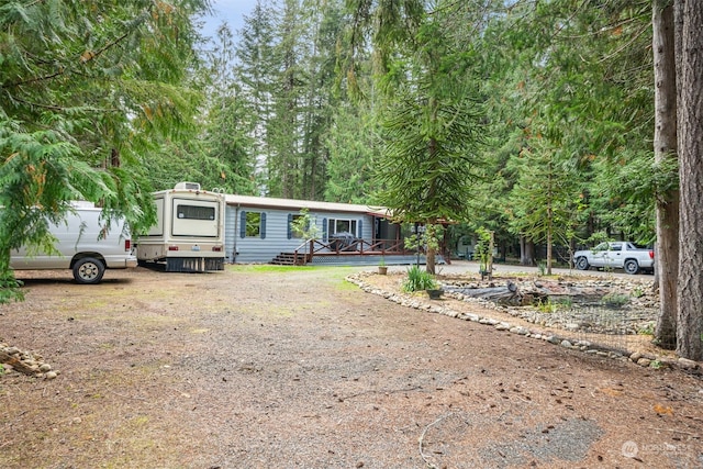 view of front of property with a wooden deck