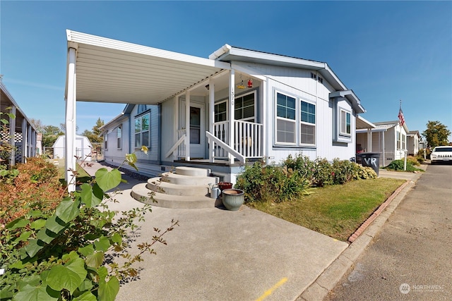 manufactured / mobile home featuring a carport