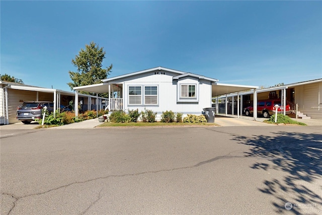 1370 Samuel Dr, Walla Walla, WA 99362 - manufactured / mobile home featuring a carport and driveway