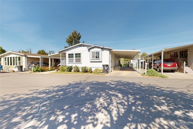 1370 Samuel Dr, Walla Walla, WA 99362 - manufactured / mobile home with a carport and driveway