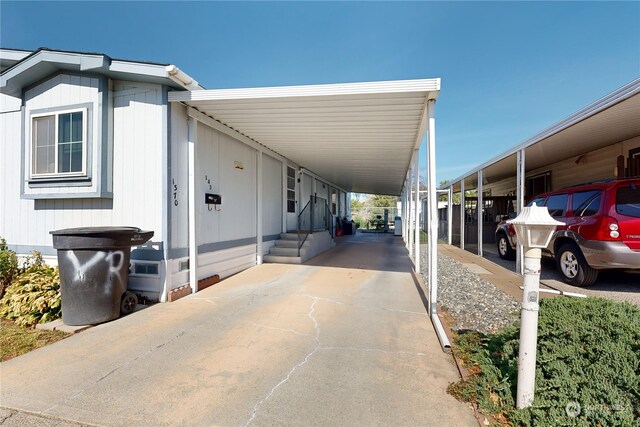 view of side of property with a carport