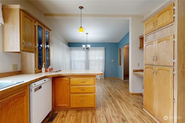 kitchen with decorative light fixtures, vaulted ceiling, light wood-type flooring, white dishwasher, and kitchen peninsula