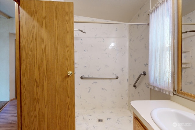 bathroom featuring vanity and curtained shower