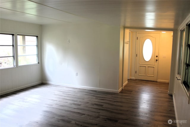 foyer featuring wooden ceiling and dark hardwood / wood-style floors