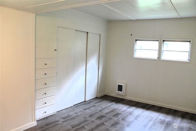 unfurnished bedroom with wood-type flooring