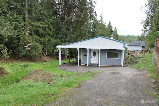 view of outdoor structure with a carport