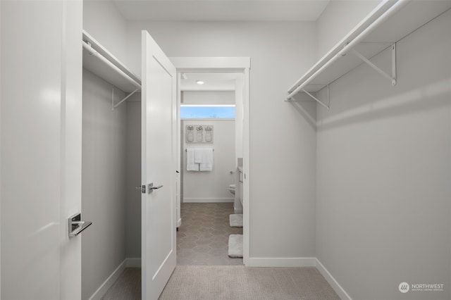 spacious closet with tile patterned flooring