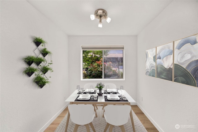 dining space featuring hardwood / wood-style flooring