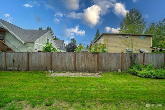view of yard with a fenced backyard