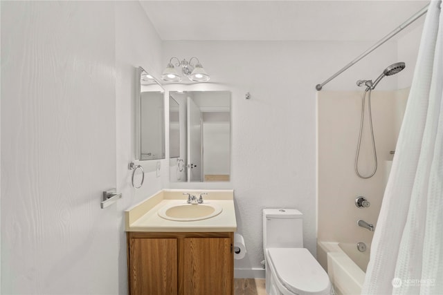 full bathroom featuring shower / tub combo, vanity, and toilet