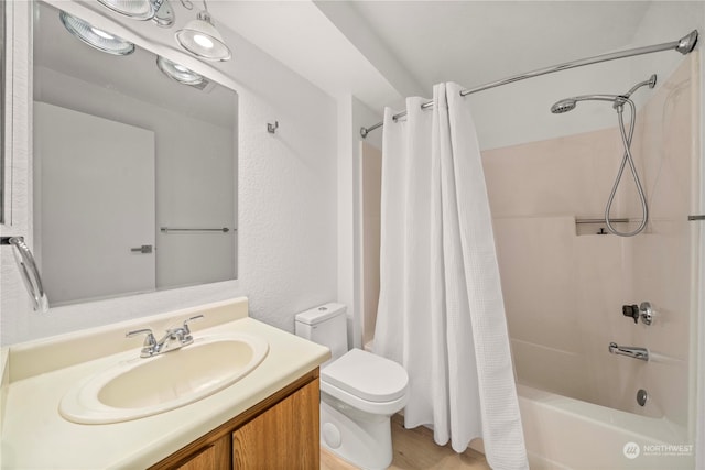 full bathroom featuring hardwood / wood-style flooring, vanity, toilet, and shower / bath combination with curtain