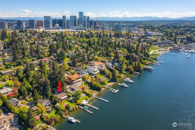 drone / aerial view with a water and mountain view