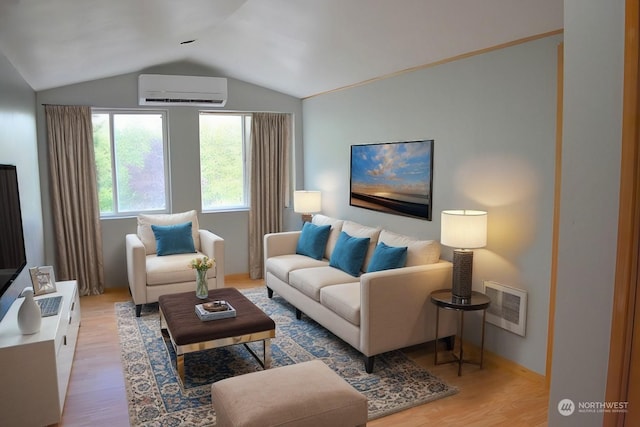 living room featuring lofted ceiling, hardwood / wood-style floors, and a wall mounted air conditioner