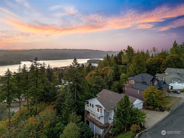 aerial view at dusk with a water view