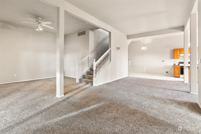 unfurnished living room featuring carpet