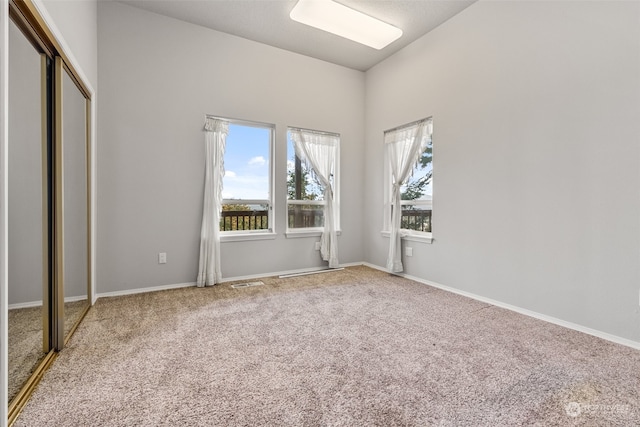 unfurnished bedroom featuring a closet and carpet floors