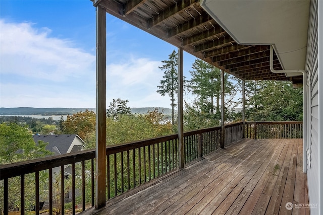 wooden deck with a water view