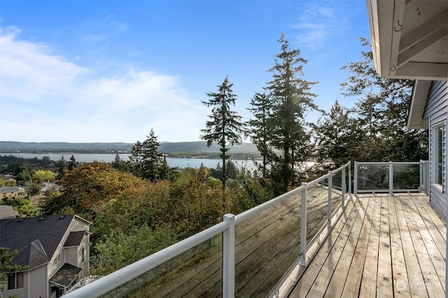 wooden deck with a water view