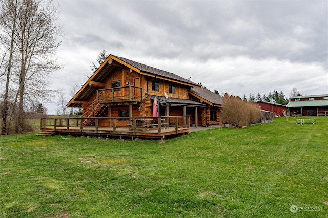 back of house with a lawn and a deck