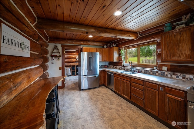 kitchen with beamed ceiling, wood ceiling, sink, backsplash, and stainless steel appliances