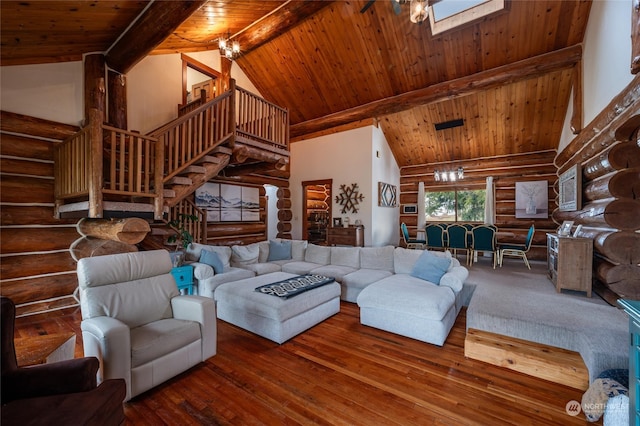 living room with a skylight, wood ceiling, beam ceiling, high vaulted ceiling, and hardwood / wood-style floors