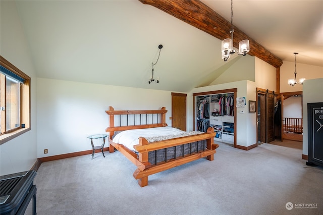 bedroom featuring carpet floors, an inviting chandelier, a closet, and lofted ceiling with beams