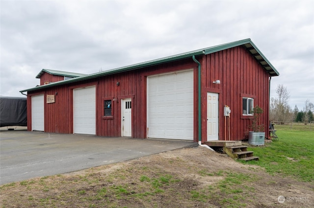 garage featuring wooden walls