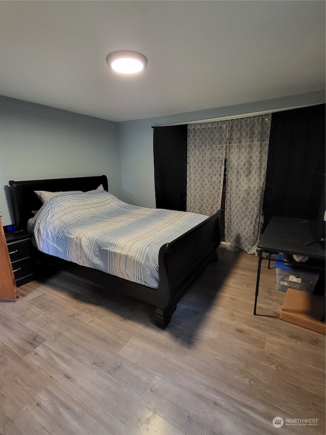 bedroom featuring light wood-type flooring