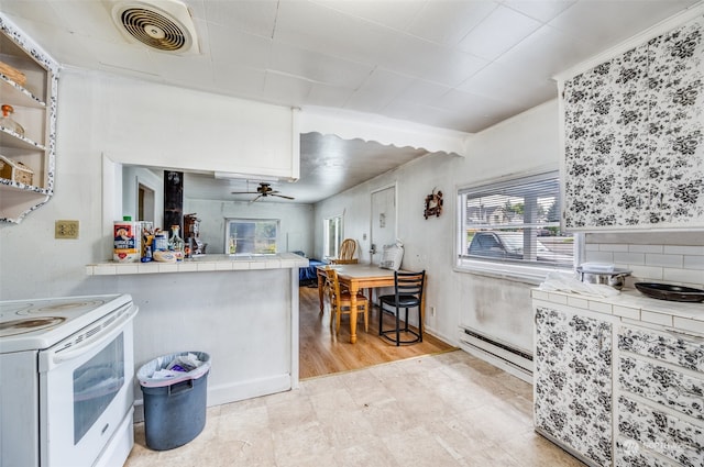 kitchen with ceiling fan, white electric range, baseboard heating, and tile countertops