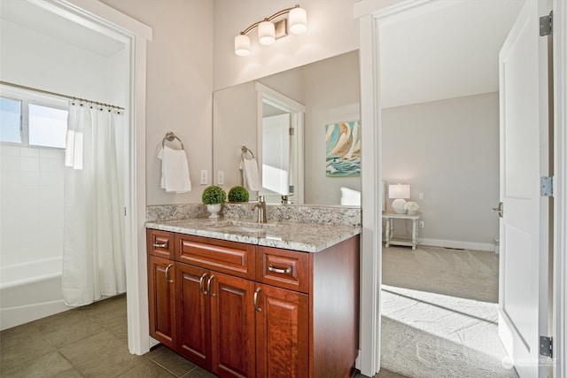 bathroom with vanity, tile patterned floors, and shower / bath combo with shower curtain