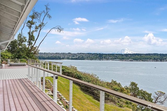 wooden deck featuring a water view