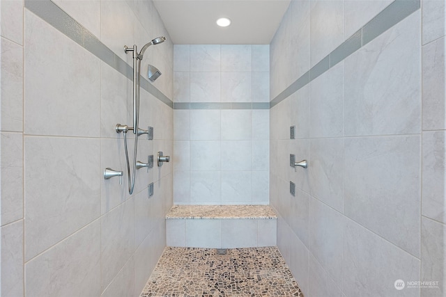 bathroom featuring tiled shower