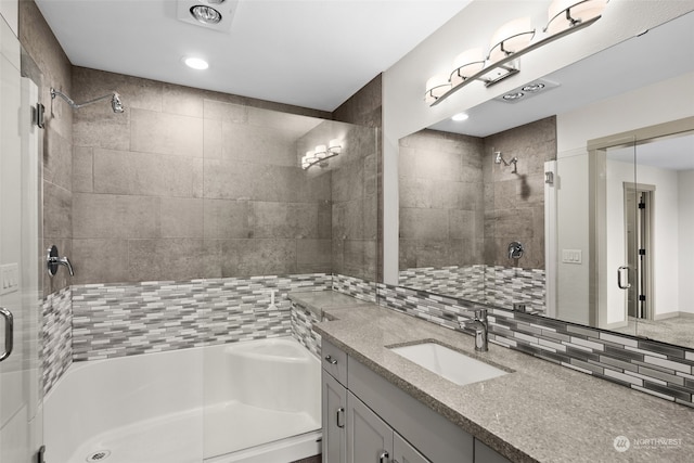 120 E 52nd St, Tacoma, WA 98404 - bathroom with vanity, a shower with door, and decorative backsplash