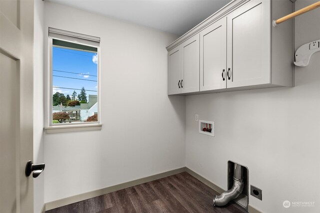 120 E 52nd St, Tacoma, WA 98404 - washroom featuring hookup for a washing machine, cabinets, dark hardwood / wood-style flooring, and electric dryer hookup