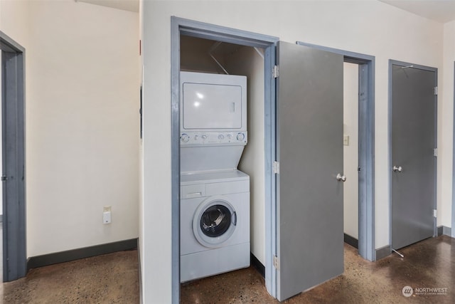 washroom with stacked washer / dryer