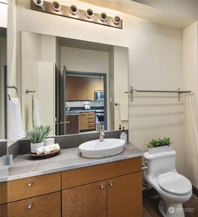 bathroom with vanity and toilet