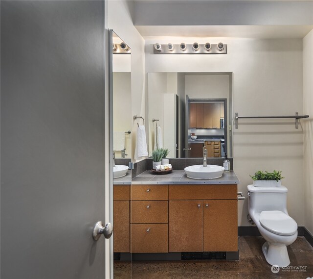 bathroom with vanity and toilet