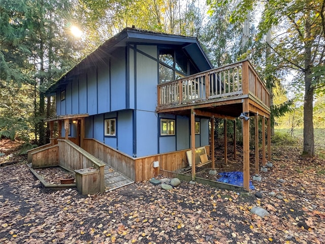 view of property exterior with a deck