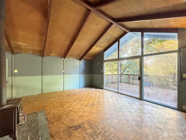 additional living space with vaulted ceiling with beams and parquet floors