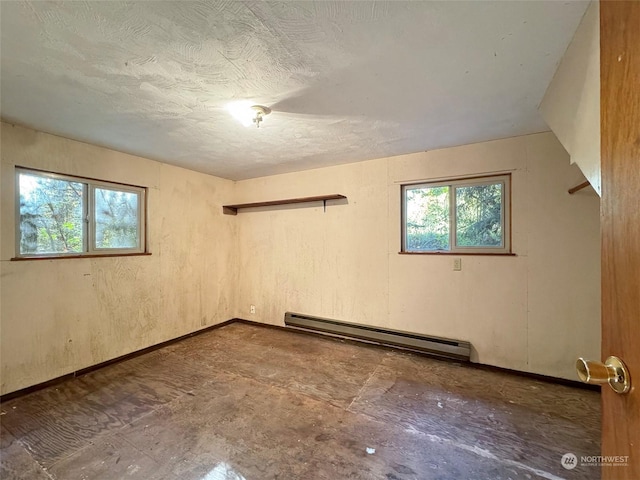 344 Dungeness Mdws, Sequim, WA 98382 - empty room with baseboard heating, plenty of natural light, and baseboards