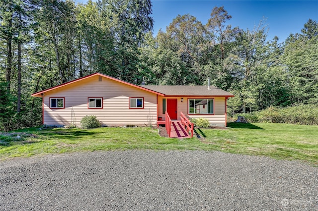 ranch-style home with a front yard